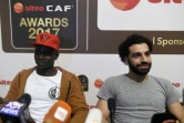 Les attaquants sénégalais Sadio Mané (g) et égyptien Mohamed Salah, tous deux joueurs de Liverpool, rencontrent la presse avant la cérémonie de remise des prix de la Confédération africaine de football (CAF), le 4 janvier 2018 à Accra  