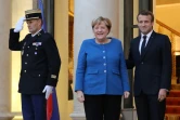 Le président Emmanuel Macron et la chancelière allemande Angela Merkel sur le perron de l'Elysée, le 13 octobre 2019 à Paris
