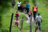 Des migrants en route pour les Etats-Unis  depuis le Nicaragua, arrivent à Trojes, le 10 juin 2022 au Honduras