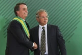 L'économiste ultra-libéral Paulo Guedes, ici le 1er janvier 2019 avec Jair Bolsonaro, est chargé du portefeuille de l'Economie