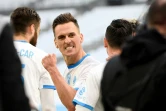 La joie de l'attaquant polonais de Marseille, Arkadiusz Milik, après avoir ouvert le score à domicile contre Brest, lors de leur match de Ligue 1, le 13 mars 2021 au Stade Vélodrome