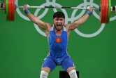 L'haltérophile kirghize Izzat Artykov lors de l'épreuve messieurs (-69 kg) aux JO de Rio, le 9 août 2016 