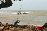 Vingt-quatre heures après le passage du cyclone Gafilo, les habitants d'Antalaha mesurent l'ampleur des dégats considérables. (Photos PY Babelon)