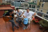 Rai, Klaus et Guillem, des Stay Homas, sur la terrasse de leur appartement, à Barcelone le 13 mai 2020 