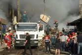 Des équipes de secours sur le site d'une explosion d'origine indéterminée qui a fait au moins six morts dans une zone commerciale d'Erevan, le 14 août 2022 en Arménie