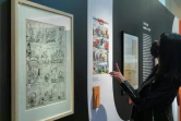 Une visiteuse regarde des planches au musée de la BD d'Angoulême qui consacre une exposition au travail de scénariste de René Goscinny, le 22 février 2022