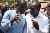 Le magnat du coton Patrice Talon (d) et l'homme d'affaires  Sebastien Ajavon après avoir voté dans le bureau de vote de Zongo à Cotonou le 20 mars 2016