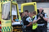 Des secouristes et des policiers sur les lieux d'une fusillade qui a fait plusieurs victimes à Copenhague, le 3 juillet 2022