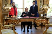 Christophe Castaner,au côté d'Emmanuel Macron et de Nicole Belloubet, lors de la promulgation des projets de loi pour la confiance dans la vie politique, à Paris, le 15 septembre 2017