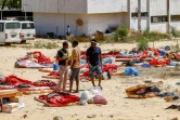 Des migrants errent à l'extérieur du centre de détention de Tajoura, dans l'est de la capitale libyenne Tripoli, le 3 juillet 2019