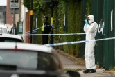 Un agent de la police scientifique recueille des indices le 6 septembre 2020 dans une rue de Birmingham, deuxième ville d'Angleterre, après que  plusieurs personnes ont été poignardées