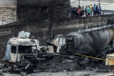 Les épaves calcinées de camions-citernes au lendemain d'une explosion près d'un stockage illégal de gaz dans le quartier d'Embakasi, le 2 février 2024 à Nairobi, au Kenya

Icône de validation par la communauté