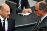 Le chancelier allemand Olaf Scholz (à gauche) et le chef de l'opposition conservatrice CDU Friedrich Merz, le 26 juin 2024 au Bundestag, à Berlin