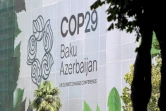 Le logo de la conférence sur le climat COP29 sur la façade d'un bâtiment en cours de rénovation à Bakou, le 11 septembre 2024 en Azerbaïdjan