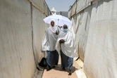 Des musulmanes arrivent à Mina pour le hajj, le 26 juin 2023 en Arabie saoudite