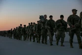 Des militaires américains s'apprêtent à embarquer pour l'Europe sur la base aérienne de Fort Bragg, en Caroline du Nord, le 14 février 2022