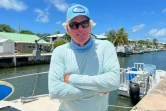 Brian Branigan, 65 ans, capitaine d'un bateau de tourisme qui vit et travaille dans les Keys de Floride depuis 15 ans pose le long des canaux de Summerland Key, le 27 juillet 2023