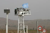 Des Casques bleus observent le point de passage entre la Syrie et une partie du Golan occupé à Quneitra, le jour de sa réouverture, le 15 octobre 2018