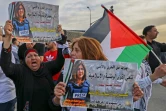 Des Palestiniens manifestent contre la mort de la journaliste d'al-Jazeera Shireen Abu Akleh tuée par balle, le 11 mai 2022 à Beit Hanina, en Cisjordanie occupée