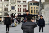 Des touristes place San Marco à Venise, le 19 janvier 2018