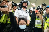 Affrontements entre policiers et manifestants dans un centre commercial de Hong Kong, le 14 juillet 2019
