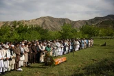 Mourners pray before the Monday burial of AFP Afghanistan chief photographer Shah Marai in Kabul on Monday