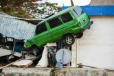 Une voiture projetée sur une maison à Palu, ville indonésienne frappée par un séisme et un tsunami. Photo du 1er octobre 2018
