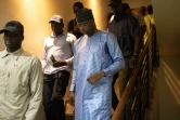 Le candidat à la présidentielle, Aliou Mamadou Dia (c), à l'issue d'une conférence de presse d'un collectif de candidats, le 23 février 2024 à Dakar, au Sénégal
