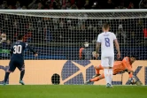 Le gardien belge du Real Madrid Thibaut Courtois arrête le pénalty tiré par l'attaquant argentin du Paris Saint-Germain, Lionel Messi, lors de leur 8e de finale aller de la Ligue des Champions, le 15 février 2022 au Parc des Princes