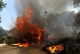 Une maison en train de brûler pendant l'incendie "Oak Fire" en Californie, le 23 juillet 2022