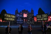 Des militants écologistes manifestent pendant la COP26, le 3 novembre 2021 à Glasgow, en Ecosse