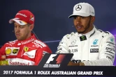 Les pilotes Sebastian Vettel (Ferrari) et Lewis Hamilton (Mercedes) après les qualifications du GP de F1 d'Australie, le 25 mars 2017 à Melbourne