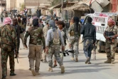Des forces progouvernementales irakiennes se préparent à d'autres opérations après avoir pris la localité de Rawa au groupe Etat islamique (EI), le 18 novembre 2017