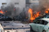 Des voitures en flammes, le 7 octobre 2023 à Ashkelon, dans le sud d'Israël, après des tirs de roquettes depuis la bande de Gaza