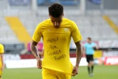 Le milieu de terrain de Dortmund, Jadon Sancho, dévoile un t-shirt en hommage à George Floyd lors de la célébration de son but face à Paderborn, le 31 mai 2020