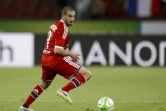 L'attaquant argentin Lisandro Lopez, alors attaquant à Lyon, contôle le ballon face au  Grasshopper en tour préliminaire de la Ligue des champions, le 6 août 2013 à Zurich