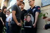 Des proches de Zhang Chaolin lors d'un rassemblement le 14 août 2016 à Aubervilliers à la mémoire de ce Chinois de 49 ans mort deux jours plus tôt des suites d'une agression