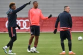 Les défenseurs du Bayern David Alaba (g), Jerome Boateng (c) et le milieu de terrain Franck Ribéry lors d'un entraînement, le 26 avril 2016 à Munich