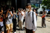 Patrick Lam (c), ancien rédacteur en chef de Stand News, arrive au tribunal, le 26 septembre 2024 à Hong Kong