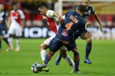 L'attaquant colombien de Monaco Radamel Falcao (g) à la lutte avec le défenseur brésilien de Montpellier Vitorino Hilton, le 1er décembre 2018 au Stade Louis-II à Monaco    