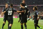 Cristiano Ronaldo (c) félicité par ses coéquipiers après son 2e but pour le Real contre le Bayern, le 12 avril 2017 à Munich