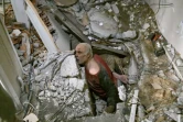 Un homme prisonnier des décombres est secouru à Antakya (Turquie), le 7 février 2023. ( AFP / BULENT KILIC )