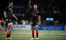 Melvyn Jaminet (bras levé) sous le maillot du Stade toulousain lors du match contre le Racing 92 à Paris La défense Arena, le 5 mars 2023 FRANCK FIFE / AFP/Archives