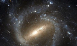 Photo d'une galaxie spirale barrée, ici NGC 1073, prise avec le télescope spatial Hubble et fournie par l'Agence spatiale européenne le 3 février 2012 ( NASA/ESA/HUBBLE / - )