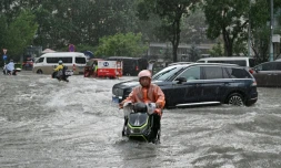 Torrential rain and flooding killed six people and forced at least 130,000 to evacuate in China's Guangxi region