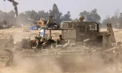 Des soldats israéliens sont positionnés dans le sud d'Israël, le long de la frontiÚre avec la bande de Gaza, le 9 janvier 2024 ( AFP / Menahem KAHANA )