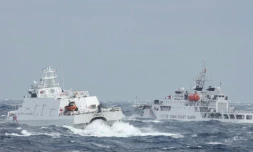 Une image rendue publique le 12 décembre par les autorités de Taipei montre des navires des garde-côtes taïwanais et chinois se surveillant mutuellement au large de l'île