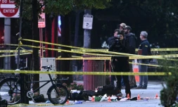 La police scientifique sur les lieux des tirs près de la Maison Blanche à Washington, le 23 mai 2026
