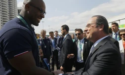 Teddy Riner et François Hollande au village olympique le 4 août 2016 à Rio