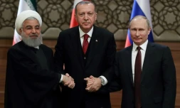 Les présidents iranien Hassan Rohani (G), turc Recep Tayyip Erdogan (C) et russe Vladimir Poutine (D) lors d'un précédent sommet tripartite sur la Syrie le 4 avril 2018 à Ankara